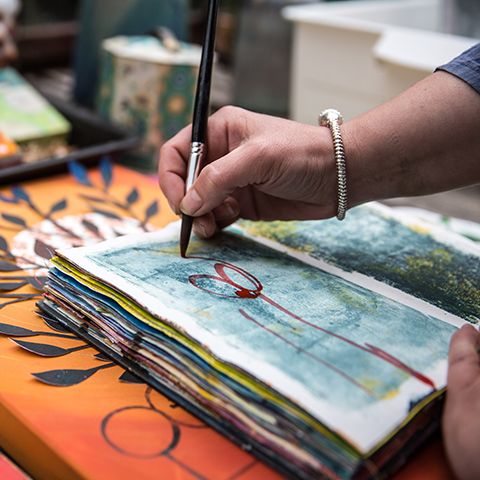 An artist painting a watercolour
